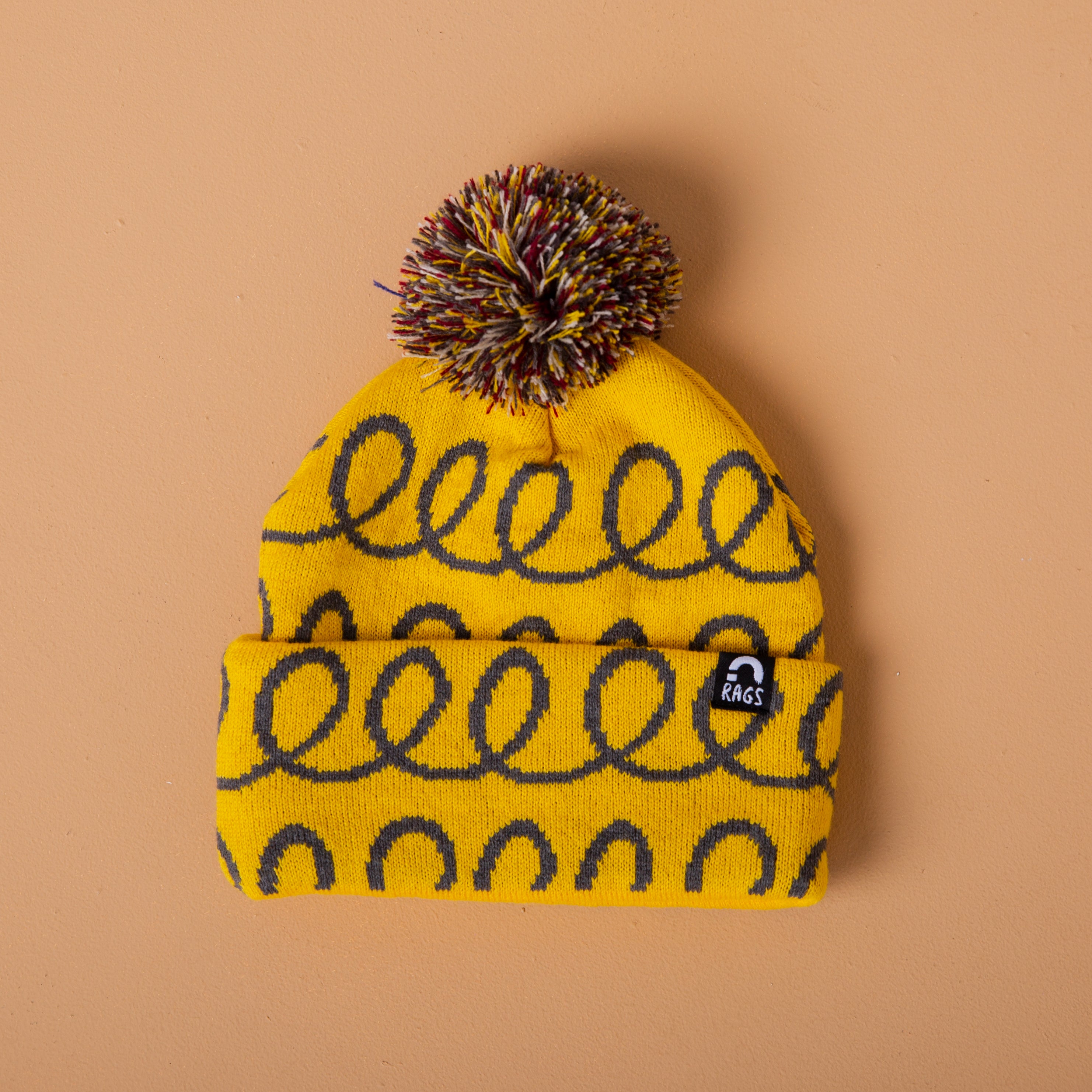 Pom Beanie - 'Yellow Loops'