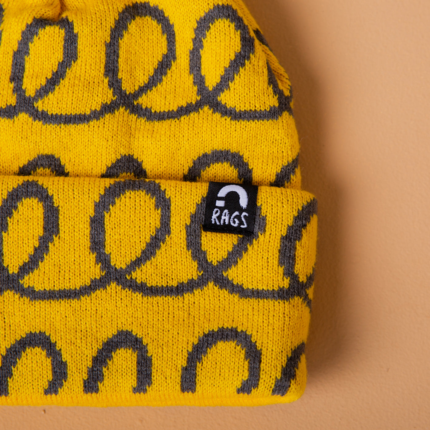 Pom Beanie - 'Yellow Loops'