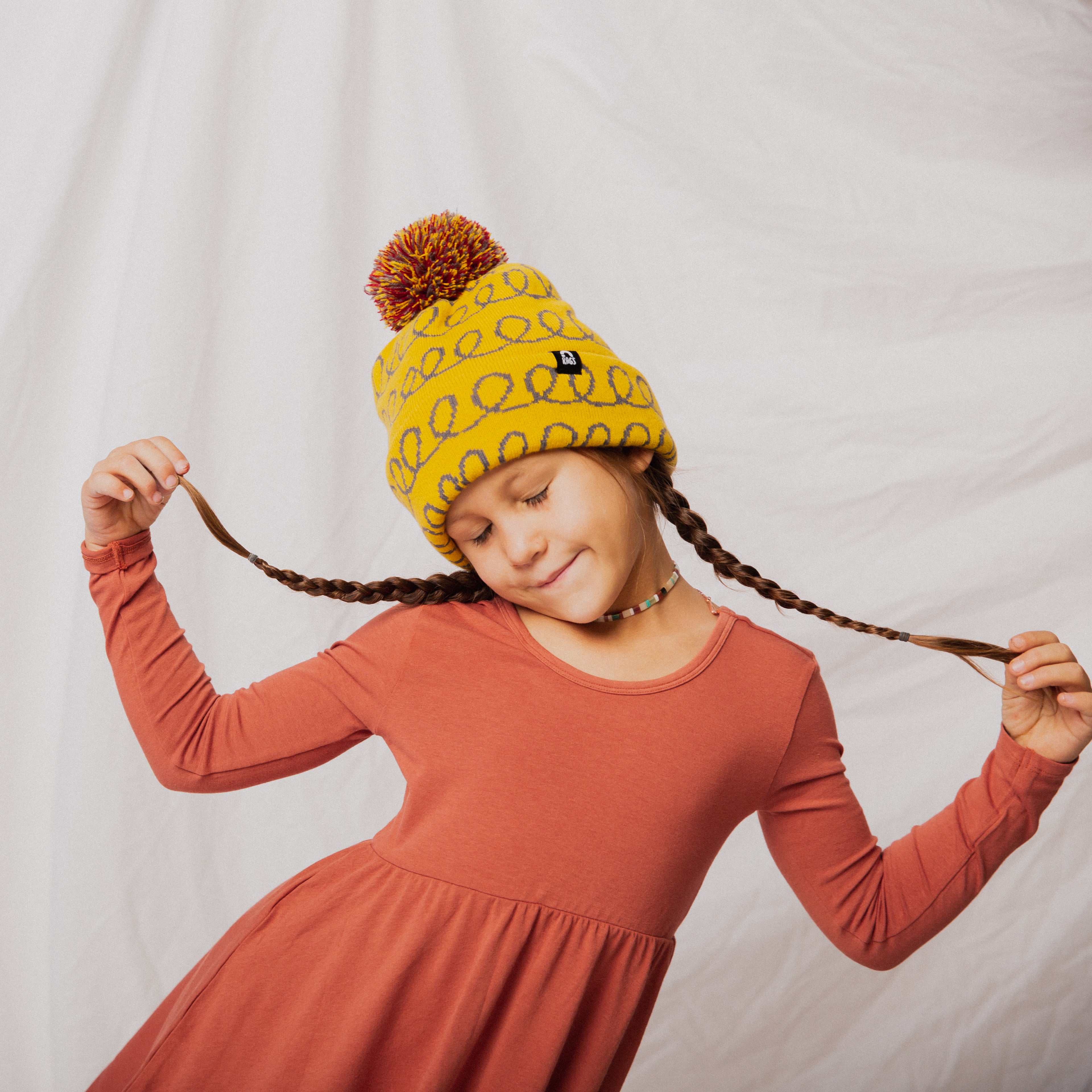 Pom Beanie - 'Yellow Loops'